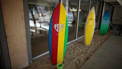 Surfboards for use by employees are lined up at the Google campus near Venice Beach, in Los Angeles, California January 13, 2012. The 100,000 square-foot campus was designed by architect Frank Gehry, and includes an entrance through an iconic pair of giant binoculars designed by Claes Oldenburg and Coosje van Bruggen. Around 500 employees develop video advertising for YouTube, parts of the Google+ social network and the Chrome Web browser at the site. REUTERS/Lucy Nicholson (UNITED STATES - Tags: SCIENCE TECHNOLOGY BUSINESS SOCIETY) - RTR2W9CL