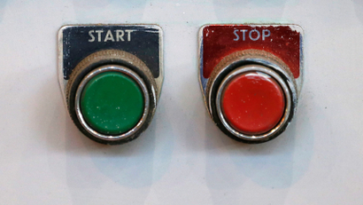 Start and stop buttons are seen in the turbine hall inside EDF Energy's Hinkley Point B Power Station in Bridgwater, southwest England