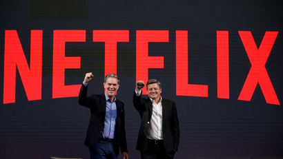 Netflix co-CEOs Reed Hastings and Ted Sarandos pose for a photo