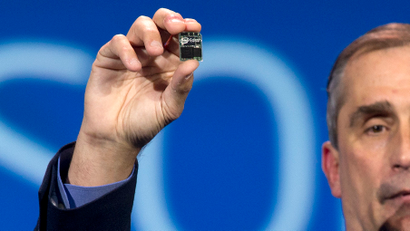 Intel CEO Brian Krzanich holds up Edison, a dual core PC the size of an SD card during a keynote address at the International Consumer Electronics Show, Monday, Jan. 6, 2014, in Las Vegas.
