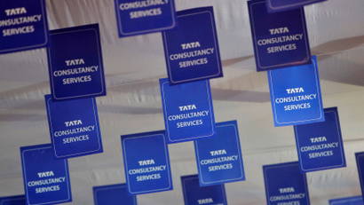 FILE PHOTO: Logos of TCS are displayed at the venue of the annual general meeting of the software services provider in Mumbai