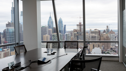Empty office overlooking Philadelphia skyline.