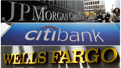 Signs of JP Morgan Chase Bank, Citibank and Wells Fargo & Co bank are seen in this combination photo.
