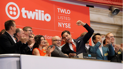 Jeff Lawson, (C) Founder, CEO, &amp; Chairman of Communications software provider Twilio Inc., rings the opening bell to celebrate his company's IPO at the New York Stock Exchange (NYSE) in New York City, U.S., June 23, 2016. REUTERS/Brendan McDermid TPX IMAGES OF THE DAY - RTX2HTCR