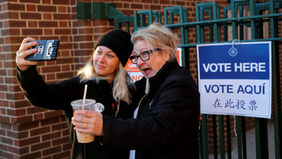 A voter poses for a selfie outside the polls after voting in the 2016 US presidential election New York.