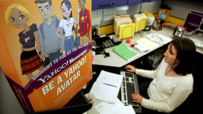 Yahoo! Inc. employee Terrell Karlsten works at her desk as she works on the Yahoo! Messenger service at company headquarters in Sunnyvale, Calif., Tuesday, Jan. 17, 2006. (AP Photo/Paul Sakuma)