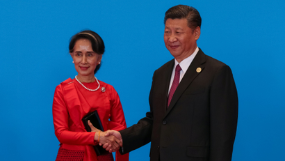 Chinese President Xi Jinping (R) shakes hands with Myanmar's State Counsellor Aung San Suu Kyi as they attend the welcome ceremony at Yanqi Lake during the Belt and Road Forum, in Beijing, China, May 15, 2017.