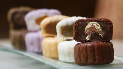 An assortment of mooncakes with their fillings showing.