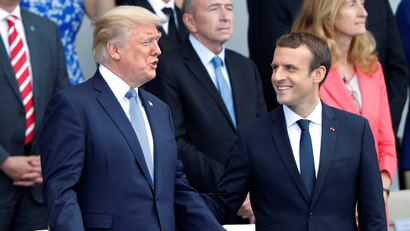 French President Emmanuel Macron and US President Donald Trump attend the traditional Bastille Day military parade on the Champs-Elysees in Paris