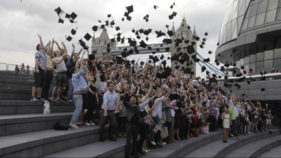 Students throwing mortar boards in London