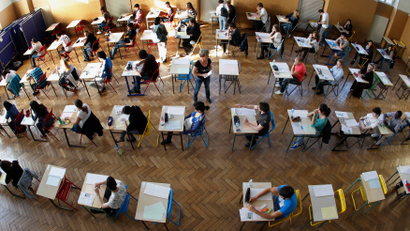 An overhead view of students taking an exam
