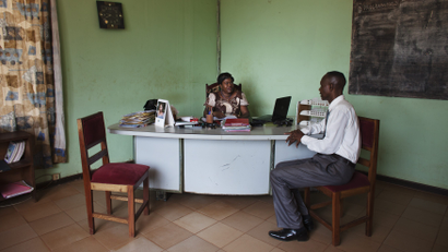 Gbianza, director of the national radio, receives a guest in her office at the radio headquarters in Bangui, Central African Republic