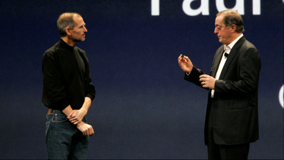 Apple CEO Steve Jobs, left, talks to CEO of Intel Paul Otellini during the keynote address at Apple MacWorld Conference in San Francisco