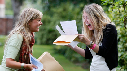 Pupils Alice Wright (L) and Rebecca Pinder from Withington Girls School in Manchester, northern England, react after receiving their A-level exam results, August 16, 2007. Alice received five A grades, Rebecca received four grade A's and an AA merit. More than a quarter of A-level papers received the top grade this year, the highest percentage ever, according to figures released on Thursday. REUTERS/Phil Noble (BRITAIN) - GM1DVYBUMYAA