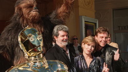 Characters from the film "Star Wars" join writer and director George Lucas, left, Carrie Fisher, center, and Mark Hamill at the world premiere of "Star Wars Special Edition" Saturday, Jan. 18, 1997, in the Westwood section of Los Angeles.