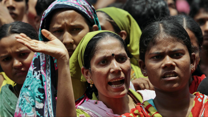 Bangladeshi garment industry workers rally on the streets demanding better conditions.