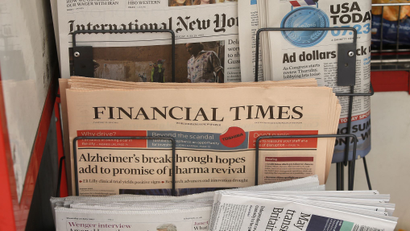 Copies of the Financial Times newspaper sit in a rack at a newsstand in London, Britain July 23, 2015. British publisher Pearson has decided to sell the Financial Times to a "global, digital news company" after owning the business newspaper for nearly 60 years, a person familiar with the deal said on Thursday. Pearson, which has become the world's leading education provider, later confirmed that it was in advanced discussions regarding a potential disposal of FT group, which includes the pink-paged paper, its website and its share in the Economist, but declined to provide further details. REUTERS/Peter Nicholls