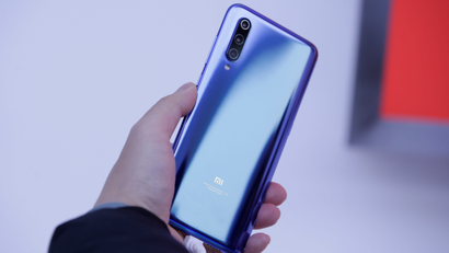 A new flagship phone Xiaomi Mi 9 is displayed after its launch ceremony in Beijing