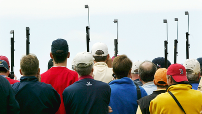 Spectators use periscopes to catch the action at the 35th Ryder Cup matches at Oakland Hills Country Club in Bloomfield Township, Mich., on Friday, Sept. 17, 2004. (AP Photo/Paul Sancya)