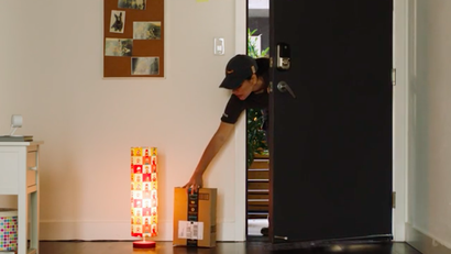Amazon Key courier delivers a package into your home.