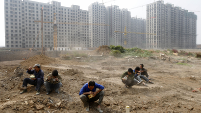 affordable housing social gdp home sales prices housing real estate property market collapse crash bubble Labourers have their lunch at a construction site in Taiyuan, Shanxi province September 29, 2009. China's provincial and municipal governments should provide more land for use for affordable housing in order to help combat the impact of a recent run-up in prices, a senior official said on Monday. REUTERS/Stringer