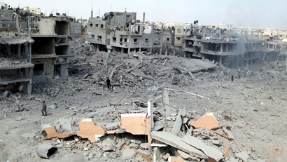 A general view of destroyed and damaged houses in Beit Hanoun town, which witnesses said was heavily hit by Israeli shelling and air strikes during the Israeli offensive, in the northern Gaza Strip July 26, 2014. Reconstruction in Gaza, where heavy Israeli bombardment in a war with Islamist militants has caused widespread devastation and displaced half a million people, will cost at least $6 billion (3.56 billion), the Palestinian deputy prime minister says. The destruction in the current conflict, now in its fourth week, is more widespread than it was in 2009. Rubble - including from homes and factories that were hit by Israeli shelling and rebuilt after the fighting five years ago - is strewn in almost every street in towns, villages and refugee camps in the densely packed, sliver-like territory of 1.8 million people. Israel has accused Hamas of causing such hardships by launching rockets at its cities from thickly-populated Gaza neighbourhoods and using mosques and schools as weapons depots, drawing Israeli fire. Picture taken July 26, 2014.