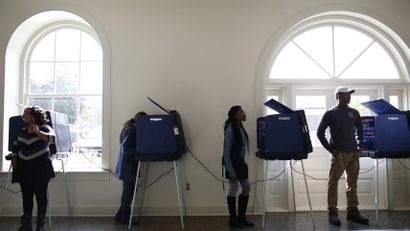 Poll workers and voters stand by the voting machines at the Marion 2 precinct at the Marion Opera House during the U.S. presidential election in Marion, South Carolina, U.S. November 8, 2016. REUTERS/Randall Hill - RTX2SKQK