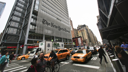 Pedestrians and vehicles move along 8th Avenue in front of The New York Times, Wednesday, May 14, 2014, in New York. The New York Times on Wednesday announced that executive editor Jill Abramson is being replaced by managing editor Dean Baquet after two and a half years on the job. The company didnt give a reason for the change. (AP Photo)