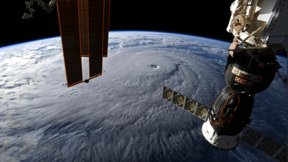 This image provided by NASA on Wednesday, Aug. 22, 2018 shows Hurricane Lane as seen from the International Space Station. The National Weather Service says the hurricane will still pack a wallop for Hawaii on Thursday before gradually slowing over the next two days. Early Wednesday, the hurricane was 320 miles (515 kilometers) south of Hilo on Hawaii Island and moving northwest toward other islands.