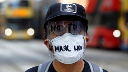 An anti-government protester wearing a mask attends a lunch time protest, after local media reported on an expected ban on face masks under emergency law, at Central, in Hong Kong, China, October 4, 2019.