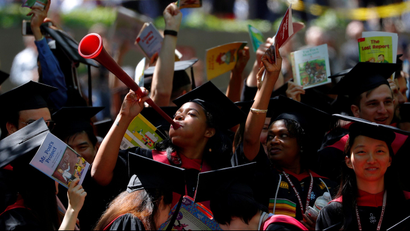 Students from the Graduate School of Education cheer as they receive their degrees during the 367th Commencement Exercises at Harvard University in Cambridge