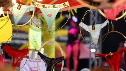 A lingerie shop with hanging underwear.