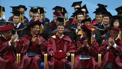 Jack Ma (C), the billionaire founder and executive chairman of Chinese e-commerce giant Alibaba Group, is applauded after delivering a speech while receiving an honorary doctorate on business administration at the University of Hong Kong of Science and Technology in Hong Kong, November 8, 2013. Seemingly slammed shut just weeks ago, the door is still ajar for Alibaba to list its shares in Hong Kong. Public comments by the Chinese e-commerce giant's founder Ma and Hong Kong politicians, blog posts from the head of the Hong Kong stock exchange, and a statement from the bourse show a thaw on a divisive issue that has captivated the Asian financial hub. REUTERS/Bobby Yip