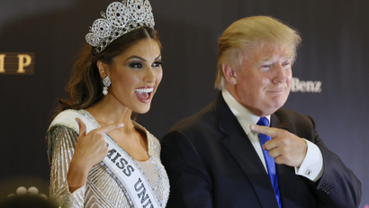 Trump poses with Miss Universe in a 2013 pageant held in Moscow