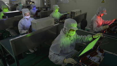 Employees work inside a LCD factory in Wuhan, Hubei province,