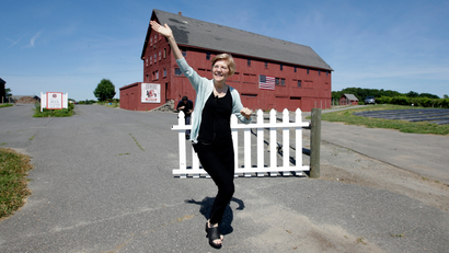 Sen. Elizabeth Warren, D-Mass., waves as she arrives at Belkin Family Lookout Farm before a town hall event, Sunday, July 8, 2018, in Natick, Mass. Warren is hosting the town hall and cookout following an Independence Day trip to visit U.S. troops in Iraq and Kuwait.