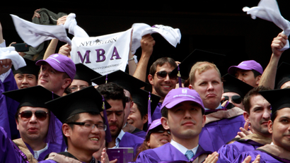 cheering MBA graduates