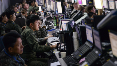 Members from U.S. and Republic of Korea militaries man the Hardened Theater Air Control Center, at Osan Air Base, ROK, during the first day of Ulchi Freedom Guardian, Aug. 17, 2015. UFG is held annually to strengthen the U.S.-ROK alliance commanders’ and staff members’ ability to translate information into actionable decision-making.
