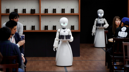 Remotely controlled robots serve customers at a cafe in Tokyo