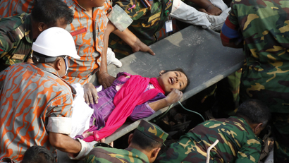 In this Friday, May 10, 2013 photo, survivor of a building collapse Reshma Begum lies on a stretcher after being pulled out from the rubble of a building that collapsed in Saver, near Dhaka, Bangladesh. The seamstress who survived 17 days before being rescued from a collapsed garment factory building was exhausted, panicked and dehydrated as she recovered in a Bangladeshi hospital Saturday, but she was generally in good shape, according to her doctors.