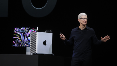 Tim Cook showing off the new Mac Pro computer