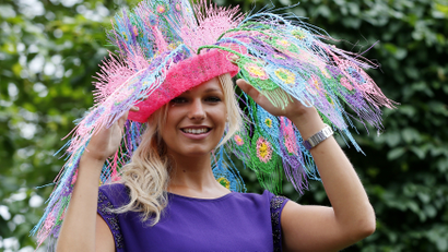 Courtney Wallis poses in a hat made with a 3D printer pen for the third day of the Royal Ascot horse racing festival at Ascot, southern England June 19, 2014. REUTERS/Suzanne Plunkett