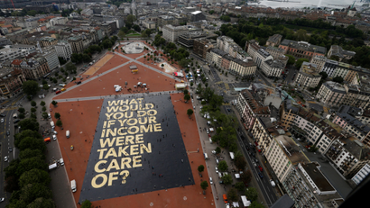 A 8,000 square meter poster is pictured on the Plainpalais square in Geneva, Switzerland May 14, 2016. The committee for the initiative for an "Unconditional Basic Income" has crowdfunded the "world's biggest poster", posing the question "What would you do if your income were taken care of ?". Swiss citizens will vote on June 5, 2016 on the proposal for an "Unconditional Basic Income". REUTERS/Denis Balibouse TPX IMAGES OF THE DAY - RTSEA8F