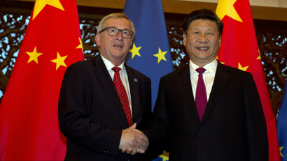European Commission President Jean-Claude Juncker (L) and Chinese President Xi Jinping shake hands before a meeting held at the Diaoyutai State Guesthouse in Beijing, China, 12 July 2016. The 18th bilateral summit between the EU and China will be held on 12-13 July in Beijing.