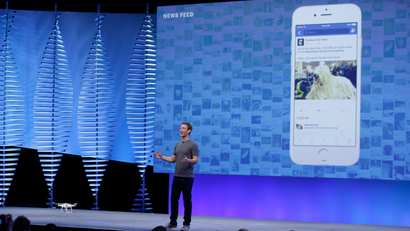 Facebook CEO Mark Zuckerberg during the keynote address at the F8 Facebook Developer Conference Tuesday, April 12, 2016, in San Francisco. Facebook says people who use its Messenger chat service will soon be able to order flowers, request news articles and talk with businesses by sending them direct text messages. At its annual conference for software developers, Zuckerberg said the company is releasing new tools that businesses can use to build "chat bots," or programs that talk to customers in conversational language. (AP Photo/Eric Risberg)