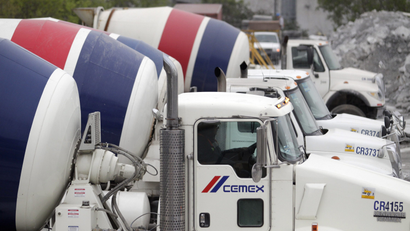Concrete mixer trucks are lined up at a concrete plant of Mexican cement maker CEMEX, in Monterrey February 24, 2015.