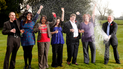 Members of a syndicate of office workers celebrate winning 45.5 million pounds (US$76 million euro50.6 million) after winning a share of the UK's largest ever lottery prize in the Euromillions lottery at the village of Thornton Hough near Liverpool, England, Tuesday Nov. 10, 2009. The winners who work for Hewlett Packard are from the right, John Walsh, Donna Rhodes, James Bennett, Alex Parry, Ceri Scullion, Emma Cartwright and Sean Connor.