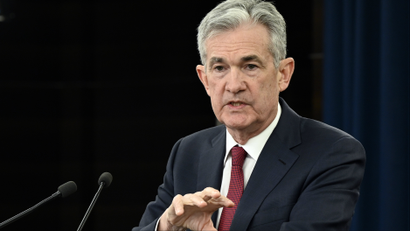 Federal Reserve Chair Jerome Powell at a lectern.