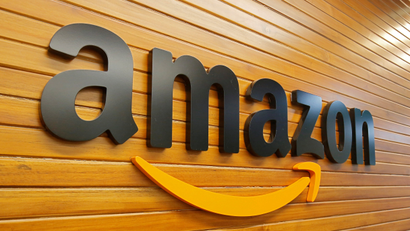 The logo of Amazon is pictured inside a company office