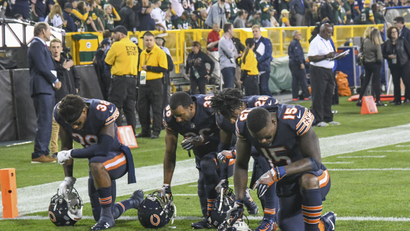 Chicago Bears players kneel in the end zone prior to their game the Green Bay Packers against before the national anthem at Lambeau Field.